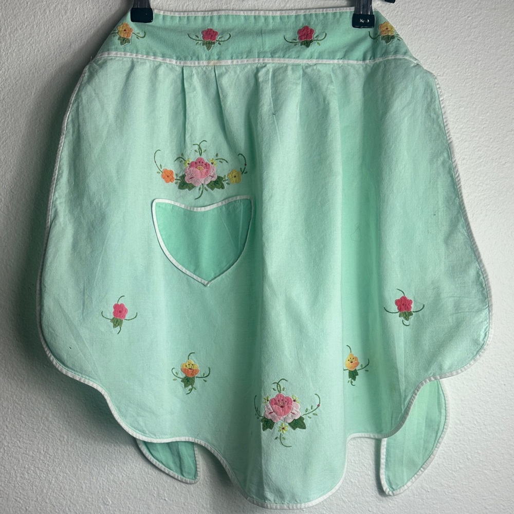 Kitchen Apron in Seafoam Green with embroidered flowers and a small pocket.